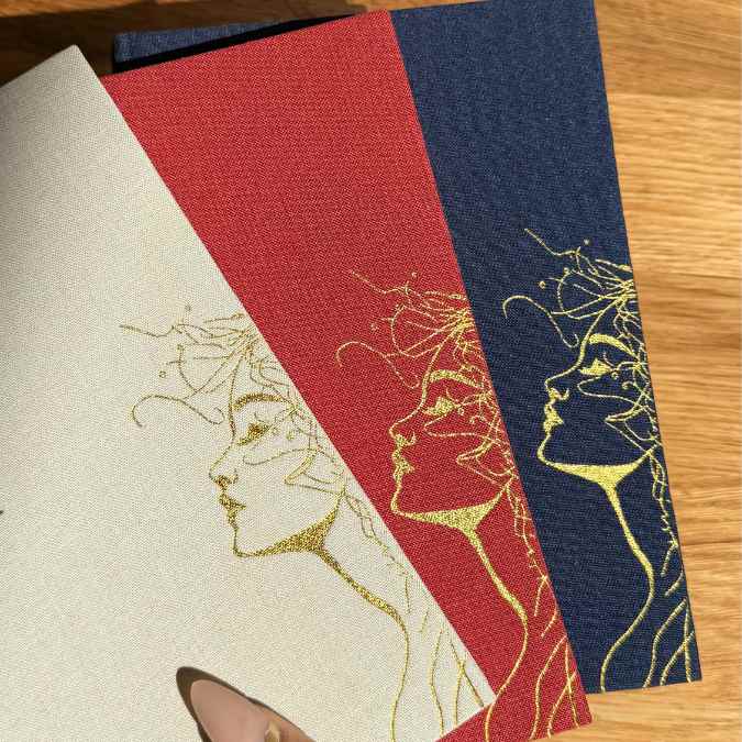 Inwords Gifting Note to Soul Notebook with soft cover, blank pages for writing, placed on a wooden desk with a pen.