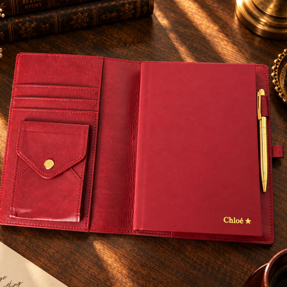 Burgundy Inwords Gifting Mémoire Journal with textured cover and gold accents, open to pages for writing and reflection.