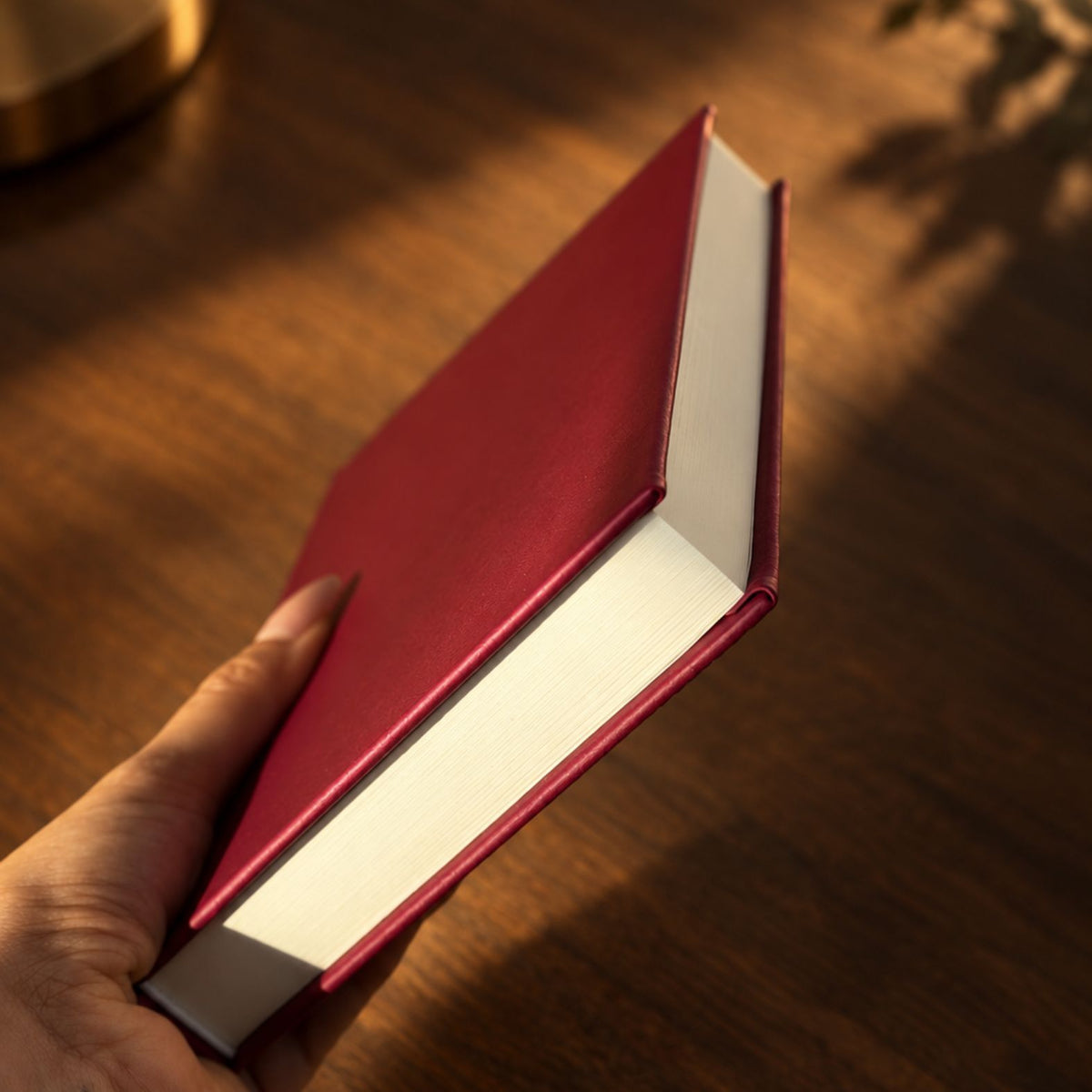 Burgundy Inwords Gifting Mémoire Journal with hardcover, featuring gold embossed lettering and lined pages for writing memories.