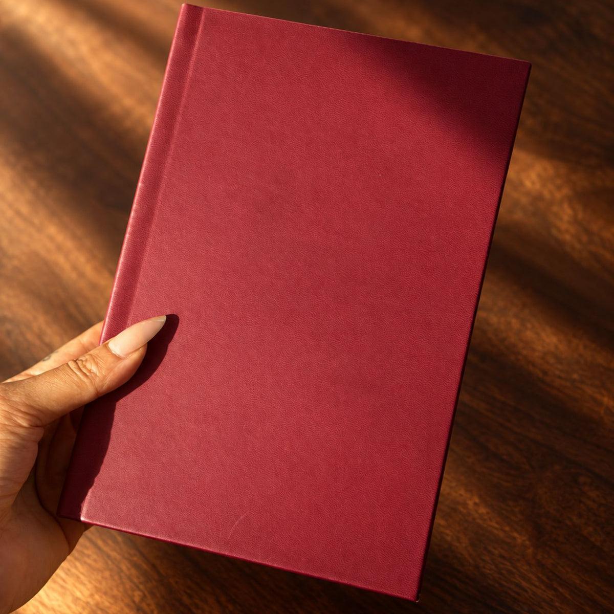 Burgundy Inwords Gifting Mémoire Journal with elegant cover and lined pages for personal writing and reflection.