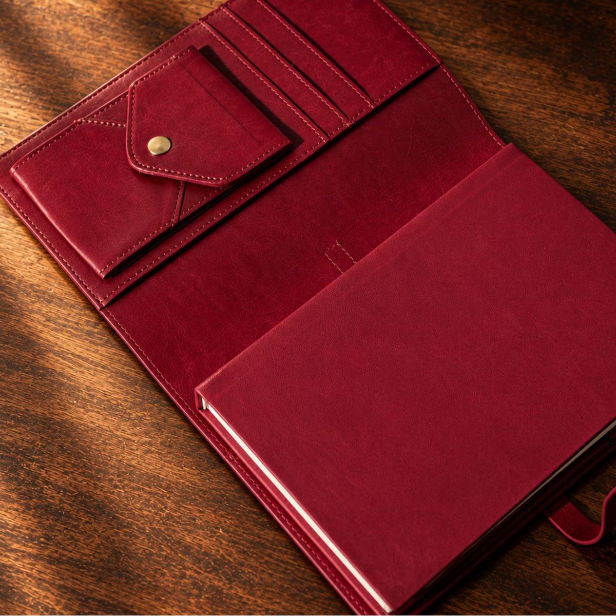 Burgundy Inwords Gifting Mémoire Journal with embossed cover, open pages for writing, elegant and stylish design for personal reflections.