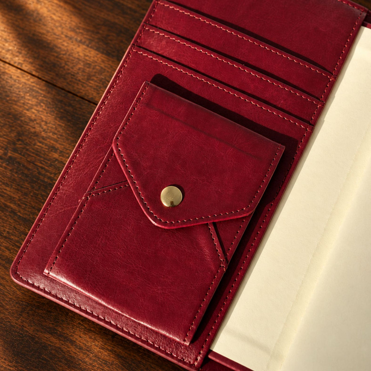 Burgundy Mémoire Journal by Inwords Gifting, hardcover with gold-embossed title and lined pages for personal writing.
