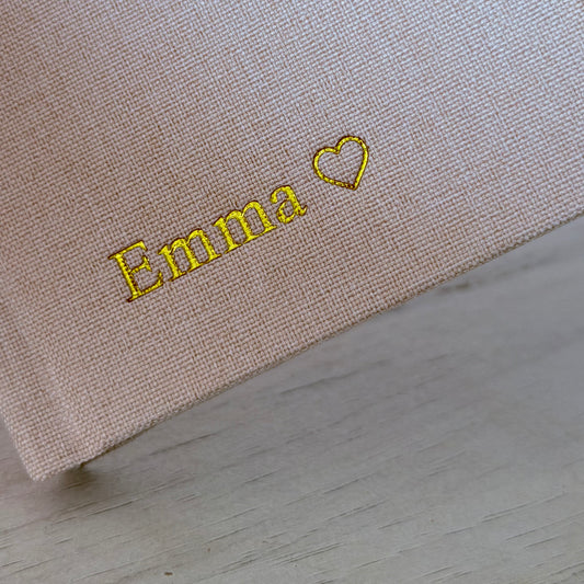 Inwords Gifting One Win at a Time Notebook with "The Power of Small Wins" cover design, featuring a spiral binding and lined pages.