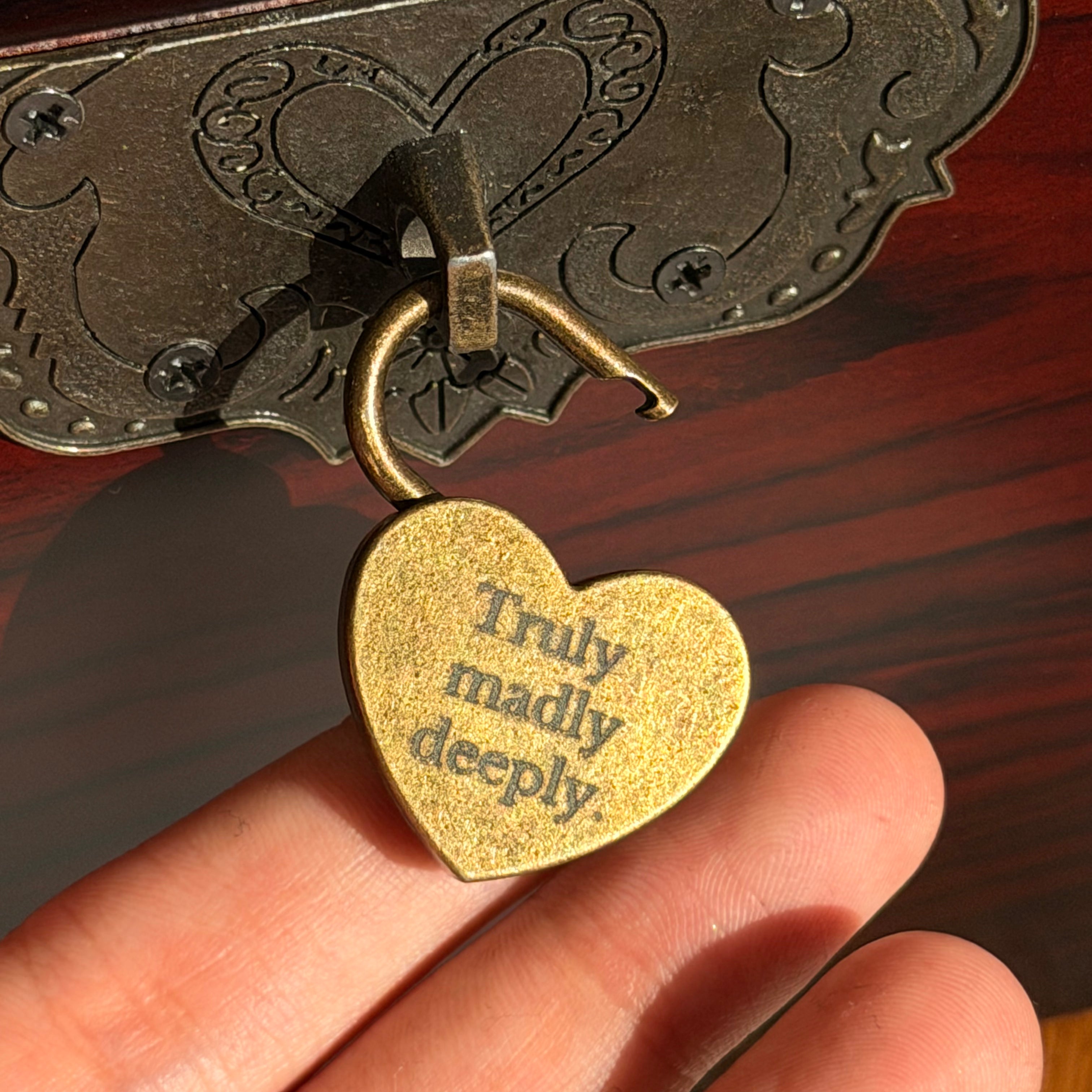 Heart lock engraved with Truly madly deeply