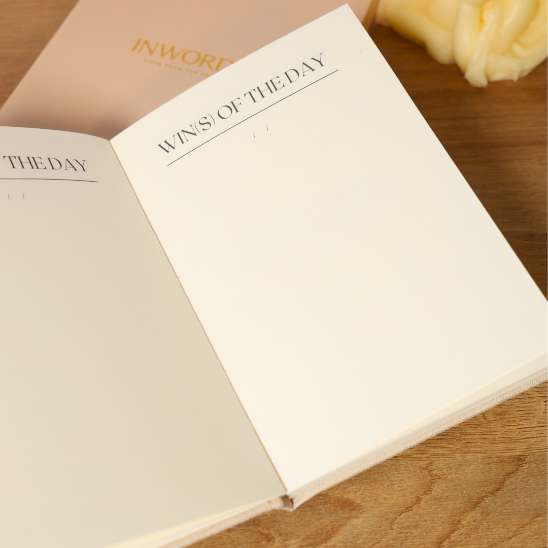 Inside pages with space to record daily wins