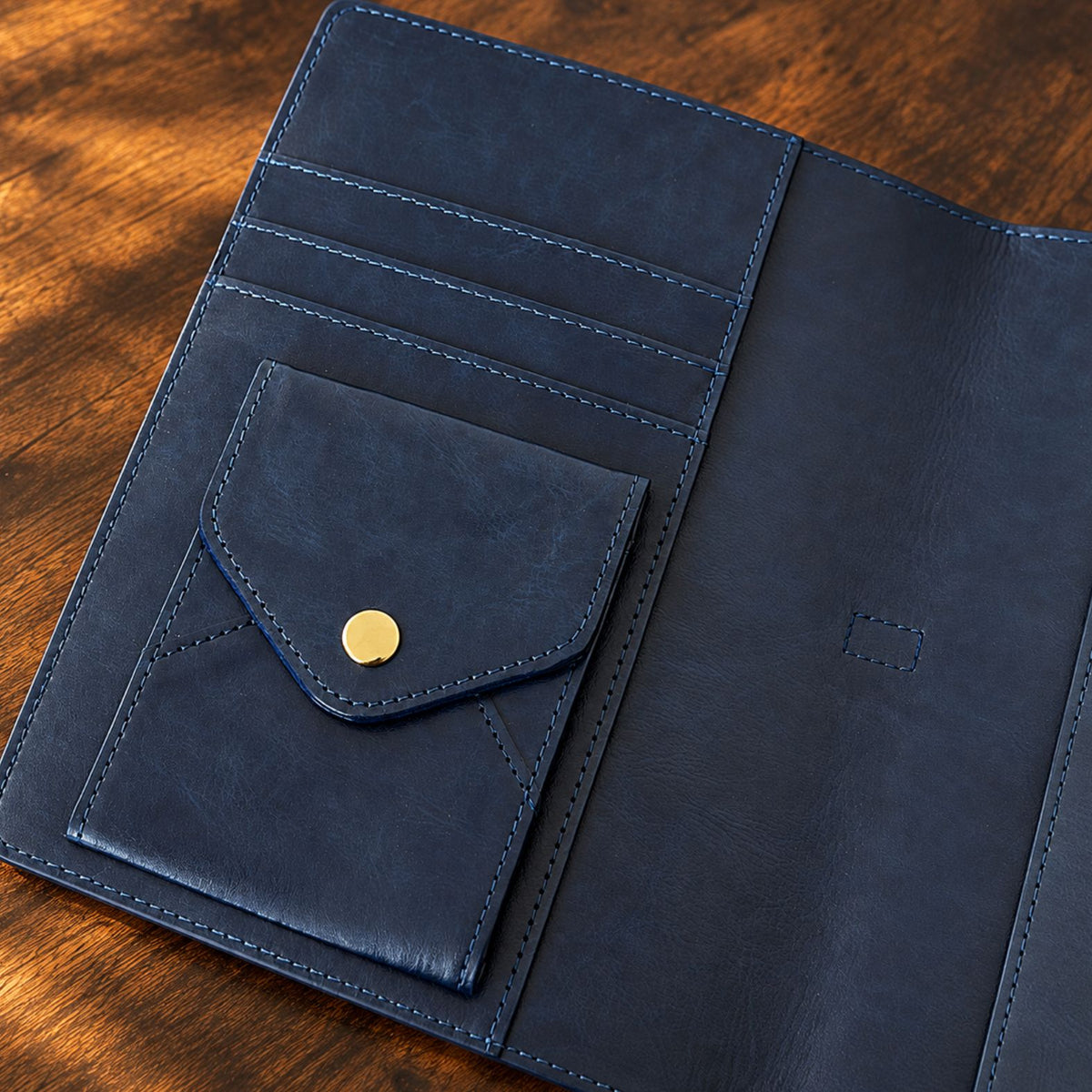 Navy blue Mémoire journal by Inwords Gifting with a soft leather cover and lined pages for personal writing and reflection.
