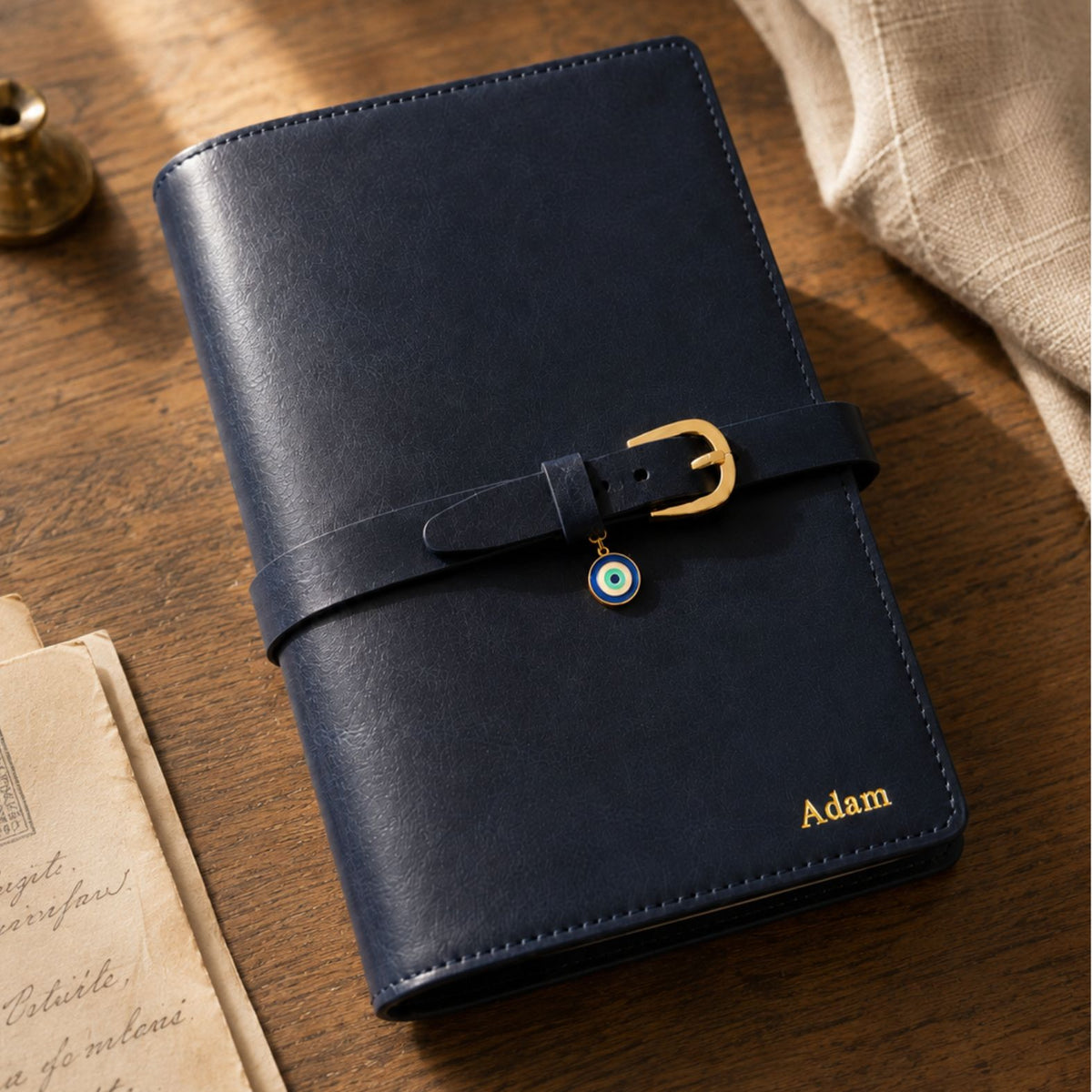 Navy blue Mémoire Journal by Inwords Gifting, featuring a hardcover with gold foil accents and lined pages for personal writing.