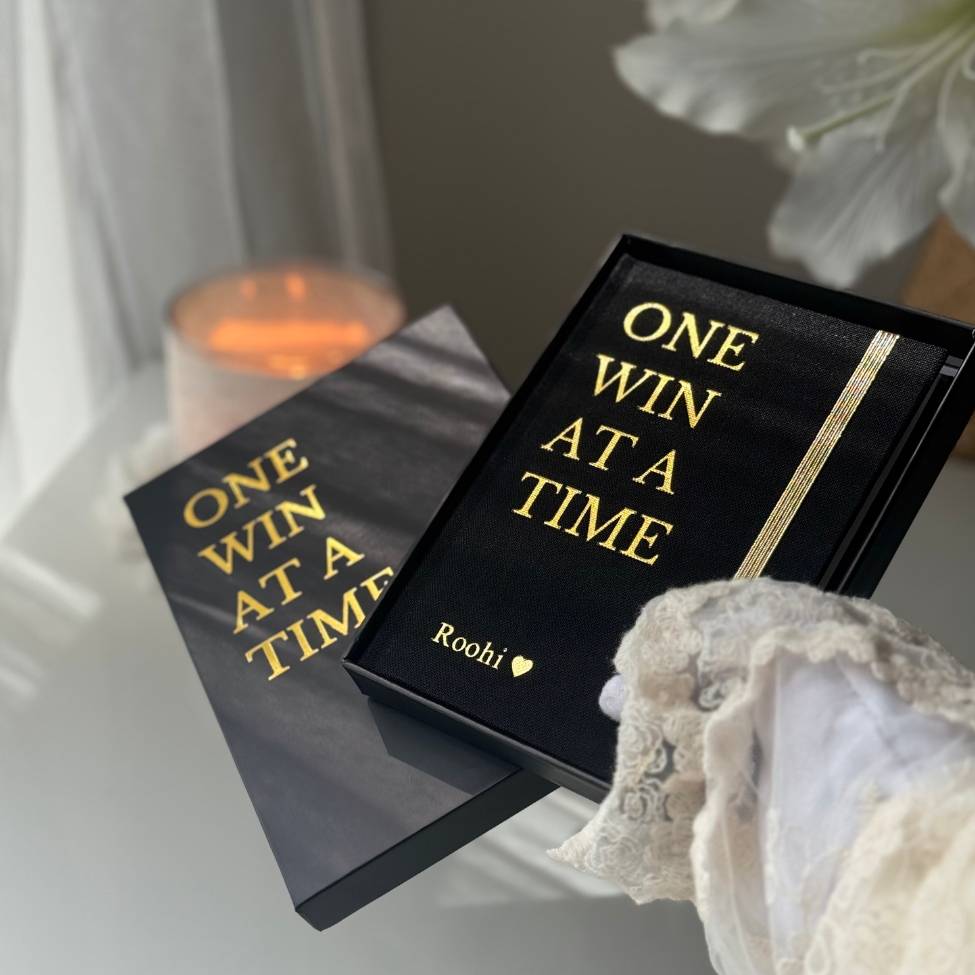Black and beige The One Win At a Time Duo by Inwords Gifting, featuring two motivational quote plaques with elegant designs.