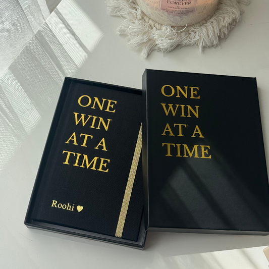 Black and beige The One Win At a Time Duo gift set by Inwords Gifting, featuring motivational message cards and elegant packaging.
