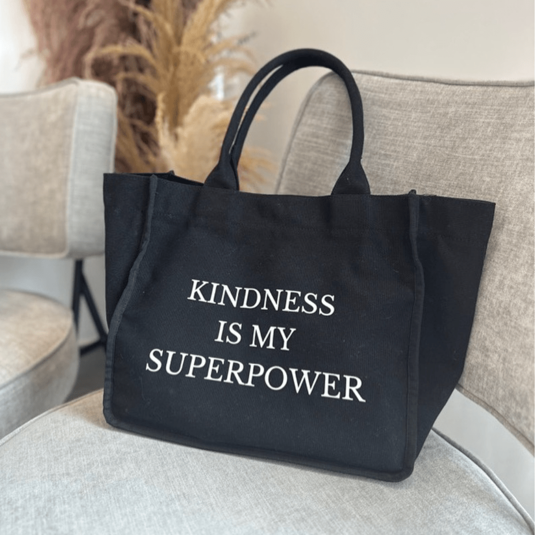 Black everyday tote bag by Inwords Gifting featuring an inspiring quote and sturdy handles for daily use.
